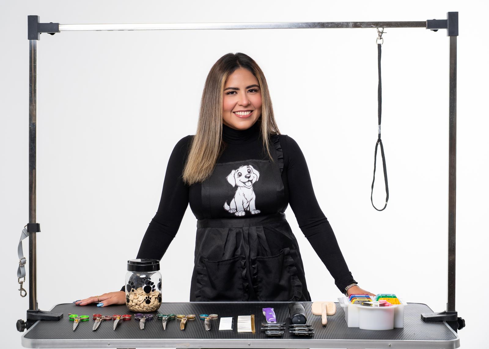 Vanessa at the Barkly’s grooming table with scissors, clippers, and brushes ready